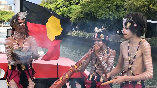 Quandamooka songman Josh Walker and indigenous dancers welcome guests aboard Australia's first-ever indigenous whale-watching boat.