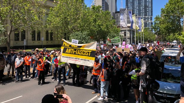 The ‘pro-vax, anti-fascist’ rally in Melbourne moves down Lygon Street on Saturday afternoon.