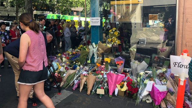 Flowers left outside Pellegrini's in Bourke Street in memory of attack victim Sisto Malaspina.