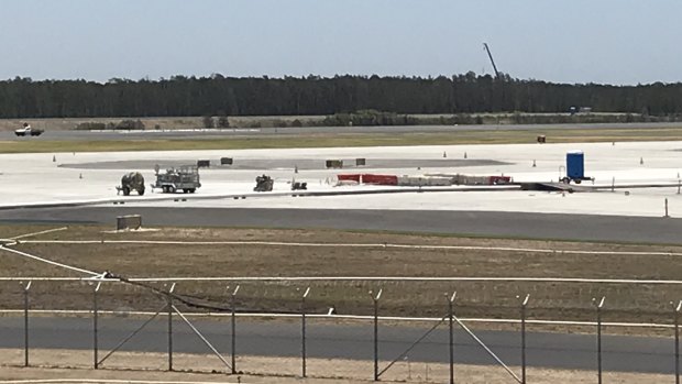 Almost there after six years.  Brisbane's new parallel runway is almost complete. Crews are now finalising the 2000 runway lights. New asphalt runway in the background.