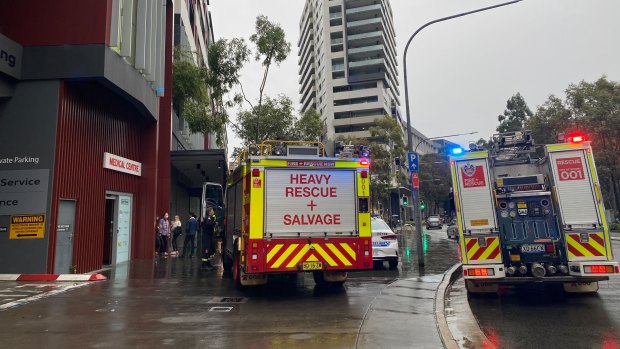At least three people are trapped in a lift at East Village shopping centre after a power outage. 