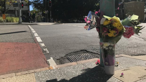 Flowers were laid at the intersection between Ann and Wharf streets where a woman died after she was accidentally hit by a bus.