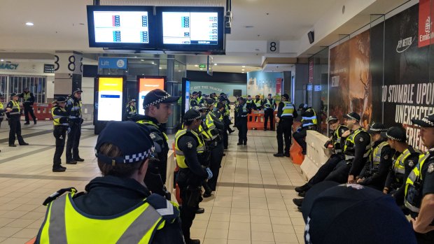 Police formed a line on the concourse above platforms 8 and 9 at Flinders Street Station. 