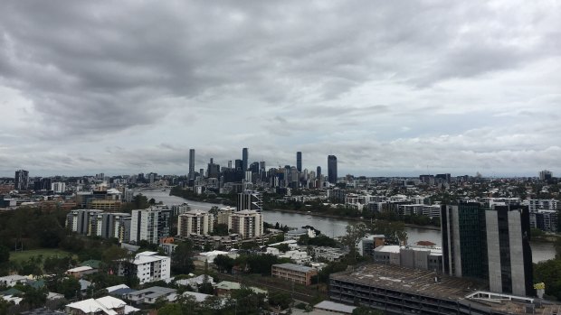 Storm clouds hang above Brisbane on Sunday morning. 