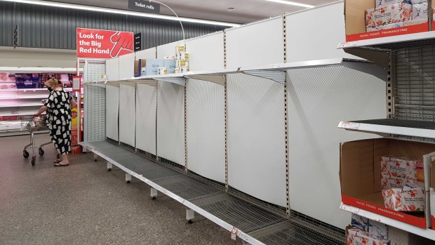 Empty toilet paper shelves at New Farm Coles on Monday.