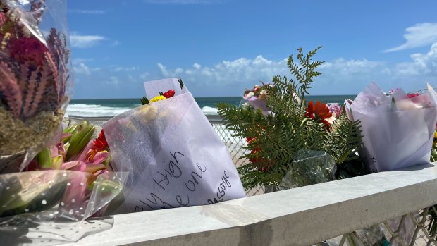Floral tributes to Charlize on the Bribie Island beach.