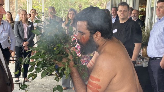 Beau Broome performs a smoking ceremony at the announcement of a partnership between Howard Smith Wharves and independent Indigenous tourism operators.