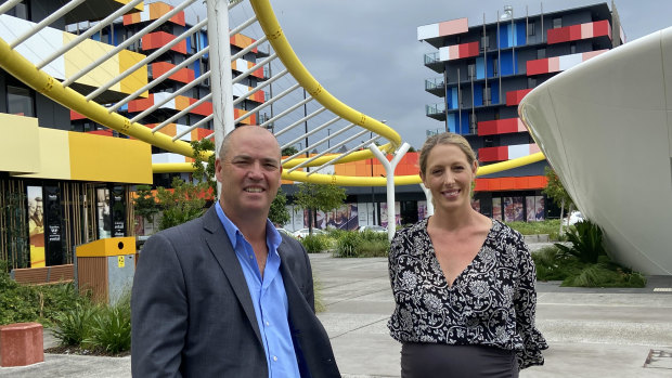 Smith Collective general manager Matt Taplin with marketing manager Alex Slingsby. Seventeen of the 19 former Games village apartment towers are now rented at 80 per cent occupancy.