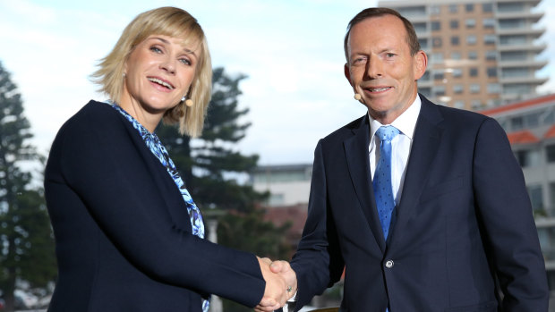 Warringah candidates Zali Steggall and Tony Abbott shake hands ahead of their debate.