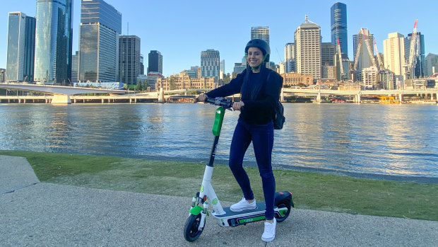 Caroline Goncalves tries out a new Lime scooter in Brisbane.