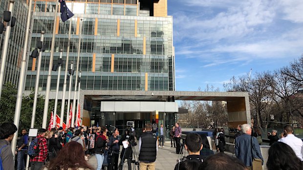 Crowds gathering outside the Federal Court in Melbourne. 