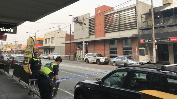 A man allegedly damaged a police car on Sydney Road.