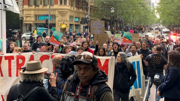 XR activists marched down Collins Street  in October.