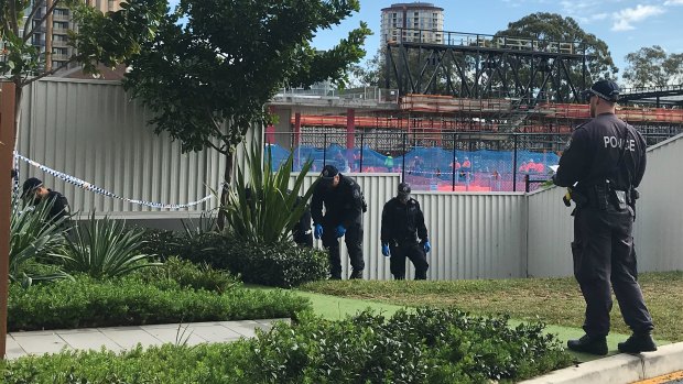 Police on Tuesday morning were combing through the bushes of the building across the road. 