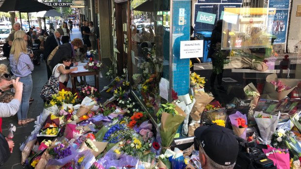 Flowers outside Pellegrini's Espresso Bar on Bourke Street, whose proprietor Sisto Malaspina was killed by Shire Ali.