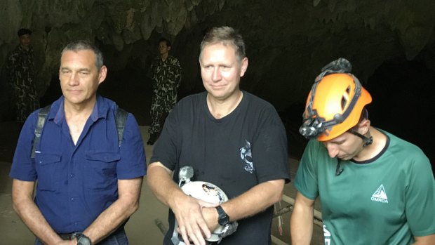 Triumphant return: Craig Challen, Richard Harris and American Joshua David Morris at the entrance to Tham Luang Cave in Thailand in April.