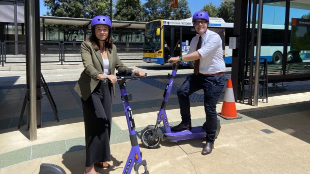 Beam Scooter’s Sarah Taylor and Councillor Ryan Murphy encourage commuters to use an e-scooter rather than drive to the bus stop or ferry stop.