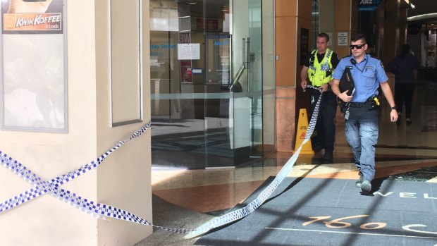 Police held a man in custody after a suspected armed hold-up on Hay Street on Thursday morning.