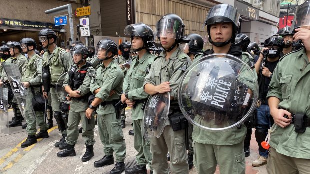 Hong Kong police prepare for a night of violence ahead of celebrations to mark the 70th anniversary of the People's Republic of China. 