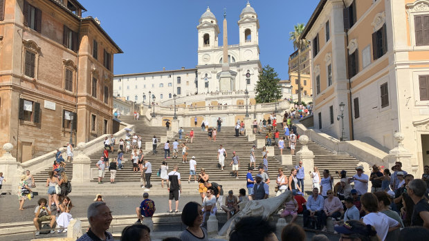 Tourists flock to the Spanish Steps in Rome.