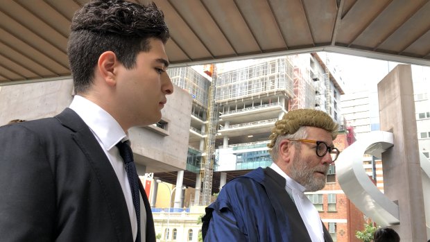 Drew Pavlou and Tony Morris outside Brisbane Magistrates Court after the application was dismissed.