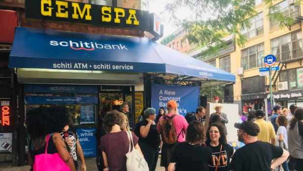 Scenes from a "cash mob" at the Gem Spa corner store. 