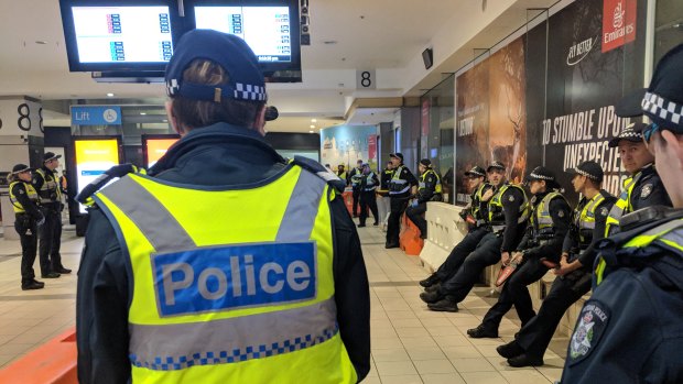 Police gathered at Flinders Street Station. 