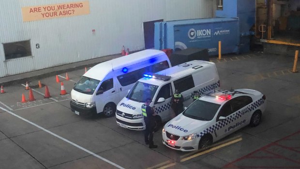 Police cars wait on the tarmac for Malka Leifer’s plane..