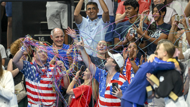 US fans wear the flag in Paris but there’s no MAGA hats in sight.