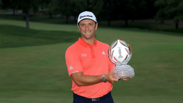 Jon Rahm of Spain celebrates with the trophy after taking out the Memorial Tournament in the US.