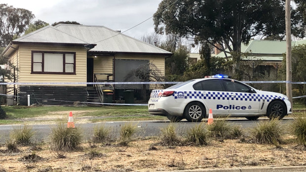 Police taped off the home in Derby Road, Maryborough, where John Bourke, 45, was found dead.
