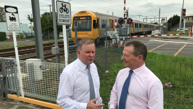 Labor frontbencher Anthony Albanese and federal MP for Moreton Graham Perrett announce $73 million as a share of the $210 million to replace the Coopers Plains rail crossing with an overpass.