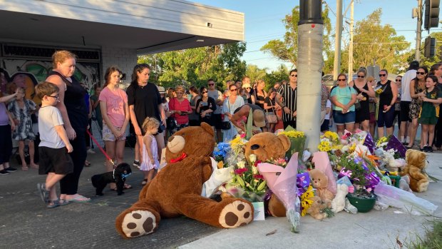 Mourners paid tribute to the couple and their unborn child, to be named Miles, at the crash site on Wednesday evening.
