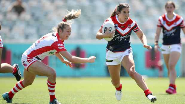 Roosters cross-code star Charlotte Caslick leaves Kezie Apps clutching at air.