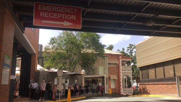 Patients lining up at the Ipswich Hospital COVID-19 testing clinic late last month.