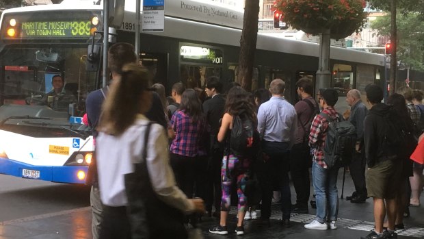 Commuters queue for the 389 bus to Pyrmont.