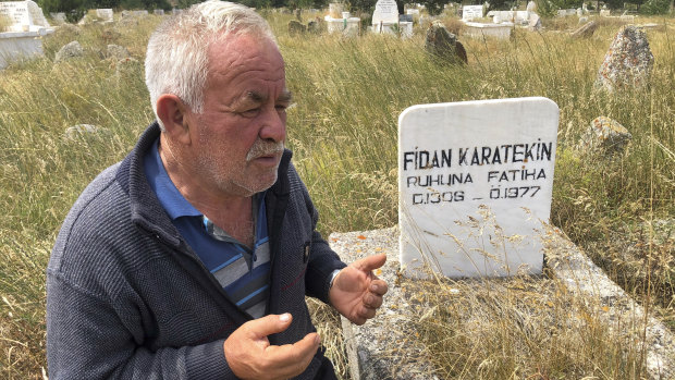 Satilmis Karatekin a distant cousin of Boris Johnson prays at the grave of a family member, in Kalfat.