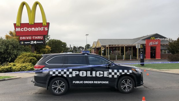 Police took cover inside McDonald's in Sunbury when their patrol car was shot at and rammed.