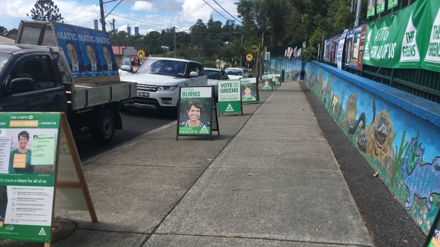 A booth at Paddington is dominated by campaign signs for Greens candidate Donna Burns, who hoped to snatch the ward from LNP incumbent Peter Matic at the Queensland local government election.