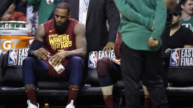 Cleveland's LeBron James sits on the bench.