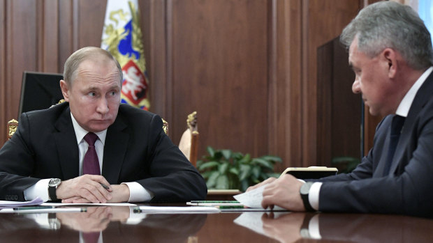 Russian President Vladimir Putin meets Defence Minister Sergei Shoigu on Saturday in the Kremlin in Moscow.