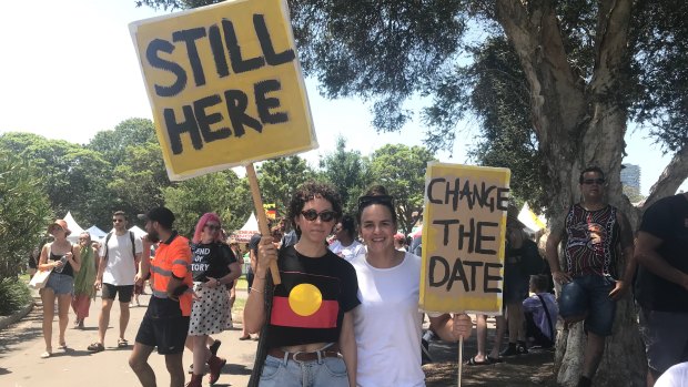 Invasion Day protesters Steffi Davis, 31, and Sophie Curtis, 30, with their signs.