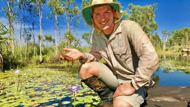 Curtin researcher Adam Cross holding a sample of the rare carnivorous plant in the Kimberley.