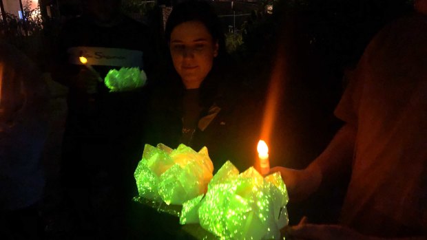 Glowing paper lotus flowers ready to be released in memory of Celeste Manno.