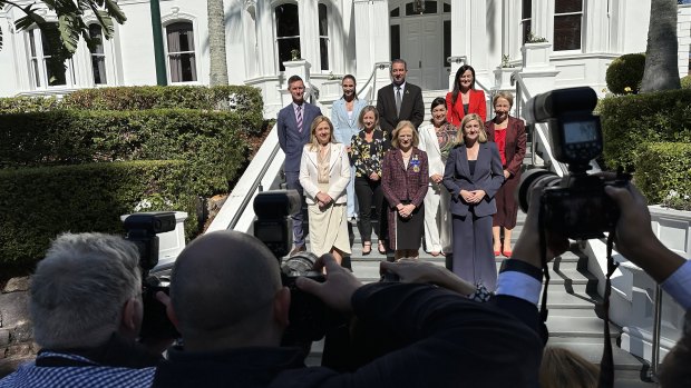 Queensland’s reshuffled ministers (left to right, from back row): Mark Bailey, Meaghan Scanlon, Craig Crawford, Leanne Linard; Yvette D’Ath, Leeanne Enoch, Di Farmer; Premier Annastacia Palaszczuk, Governor Jeannette Young, Shannon Fentiman.