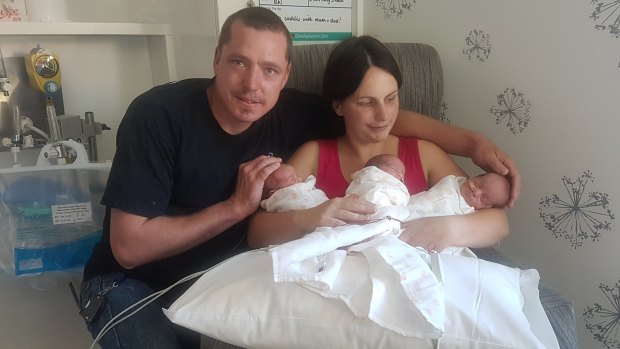 Matt and Emma Keen with their new baby girl triplets.