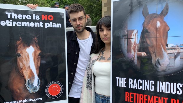 Adam and Lauren Trani protested against animal cruelty at the Melbourne Cup Parade. 