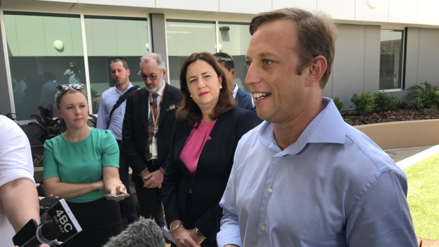 Queensland Health Minister Steven Miles (front, right) speaks to media alongside Premier Annastacia Palaszczuk.