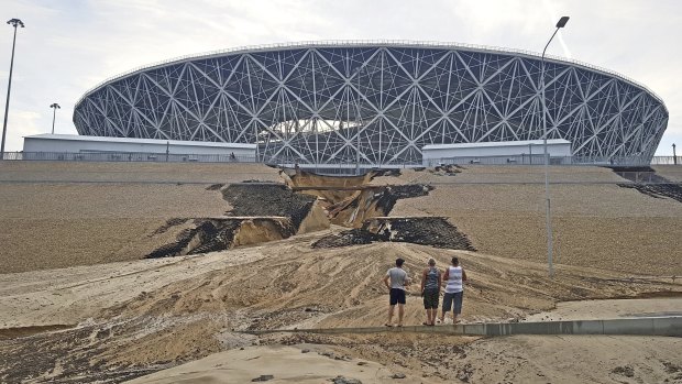 A huge crack has formed in an embankment outside Volgograd Arena after heavy rain triggered a landslide.