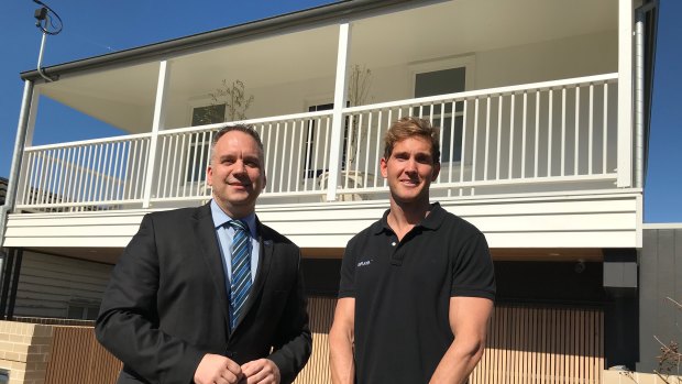 Andrew Gray (right) with Matthew Bourke outside his renovated Paddington Queenslander.